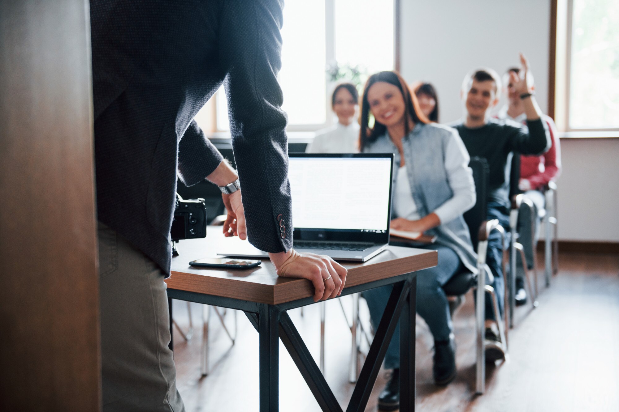 man-have-question-hand-raised-up-group-people-business-conference-modern-classroom-daytime_146671-16286